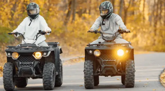 Couple riding atvs