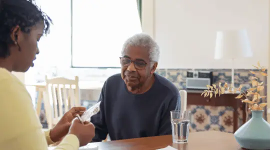 Daughter-helping-elderly-father