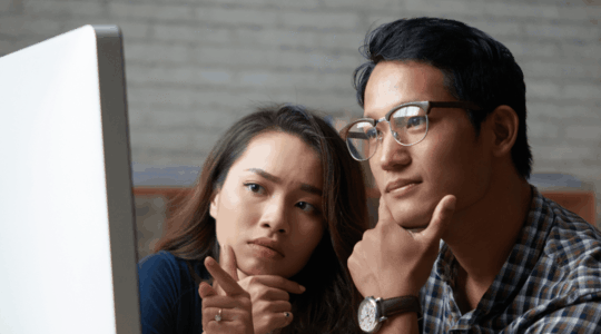 couple-researching-healthcare-costs-on-computer
