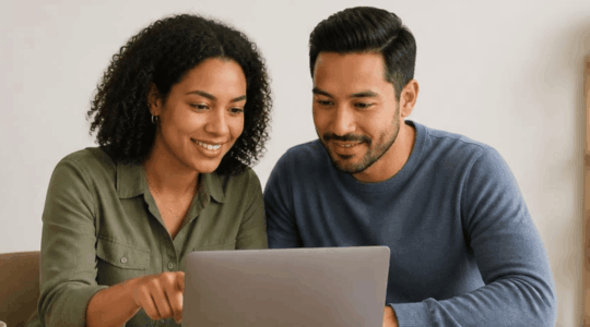 Couple reviewing benefits enrollment on laptop 1600 600