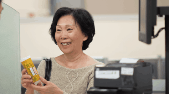 woman-picking-up-medication-at-pharmacy