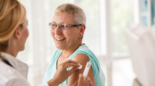 Doctor treating smiling patient