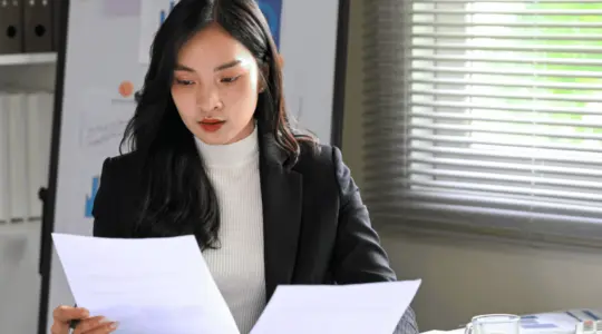 Executive-reviewing-policy-updates