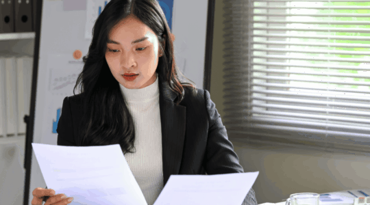 Executive-reviewing-policy-updates